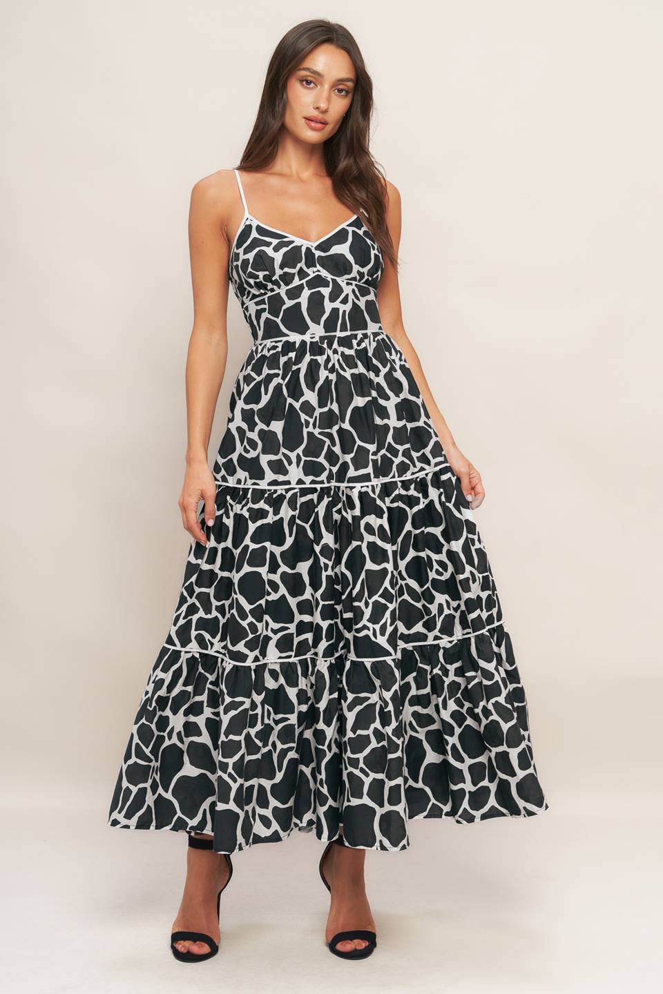 A printed woven midi dress featuring cami top
